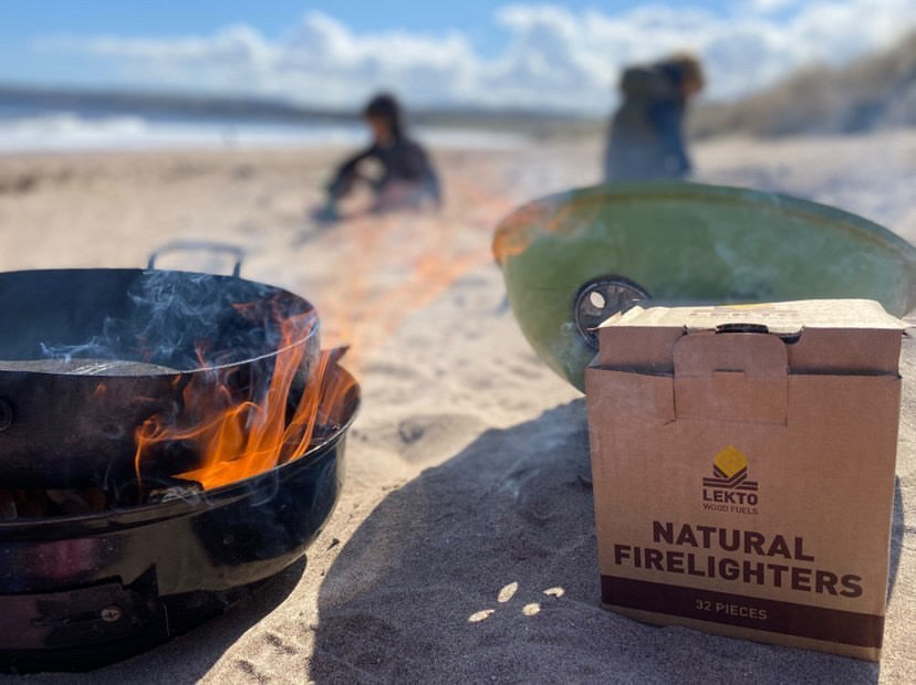 Lekto Wood Fuels Natural Firelighters on a beach next to a BBQ