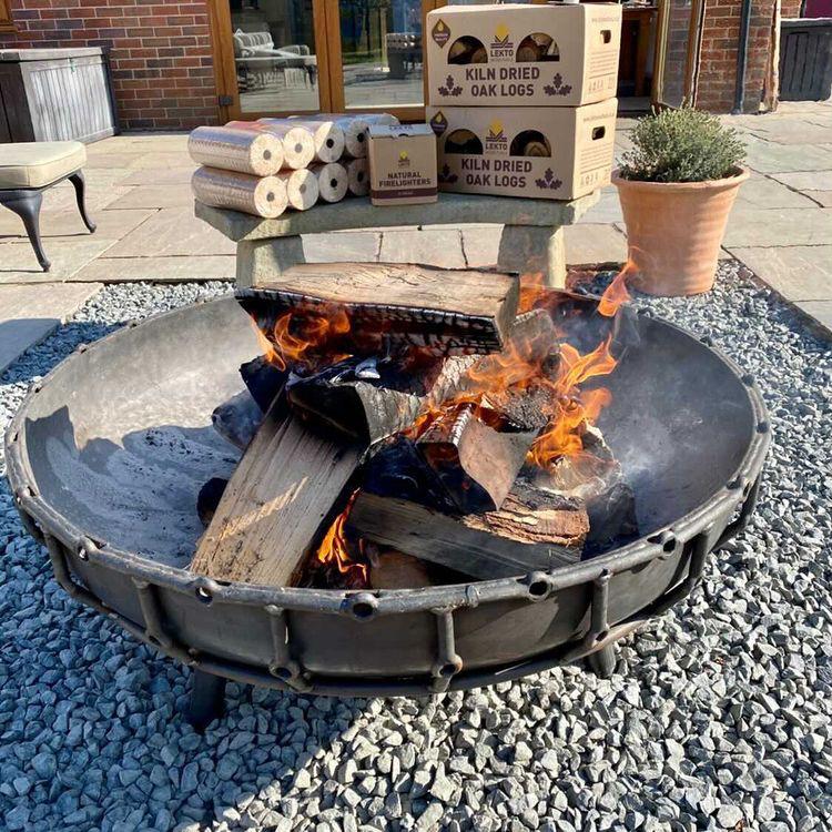Wood burning in a concrete fire pit table