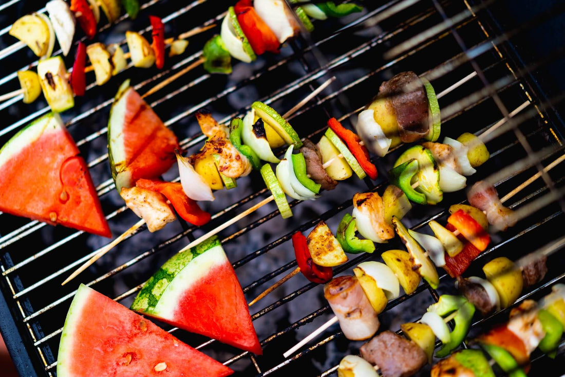 BBQ Meat & Veg skewers and watermelon triangles on a BBQ