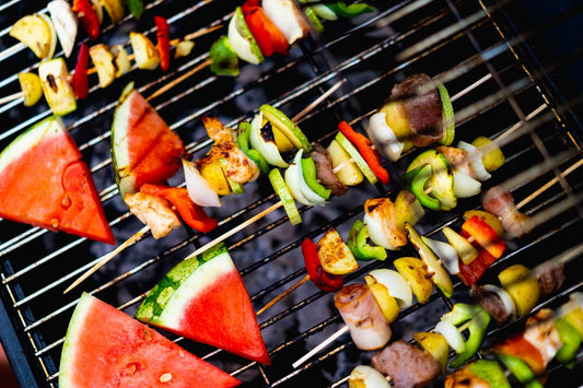BBQ Meat & Veg skewers and watermelon triangles on a BBQ