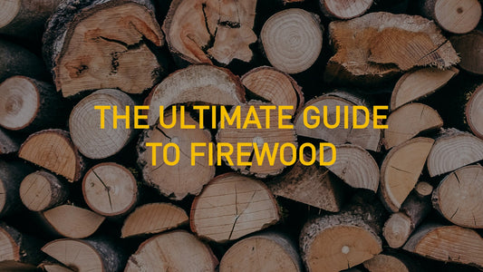 The Ultimate Guide To Firewood Written in front of piled up logs