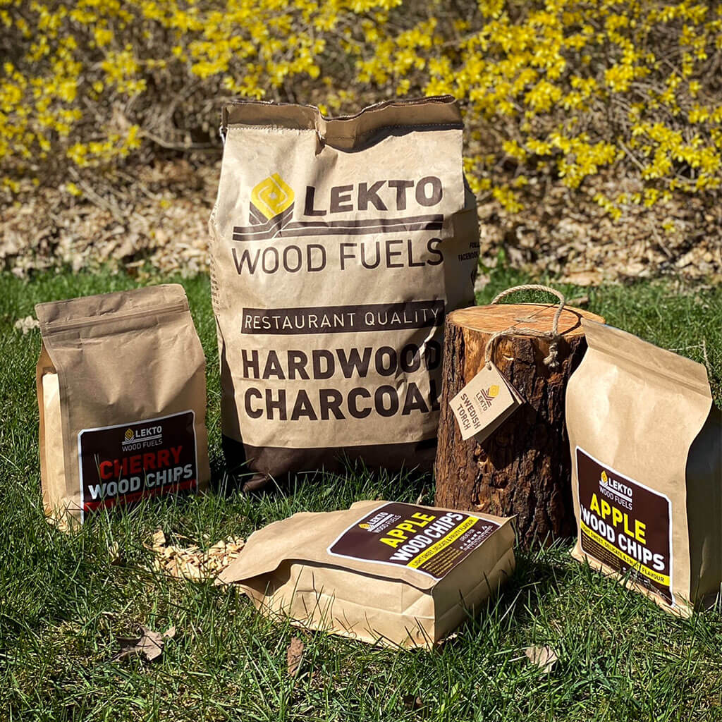 Lekto Wood Fuels BBQ and Grill Wood Fuel products on a lawn